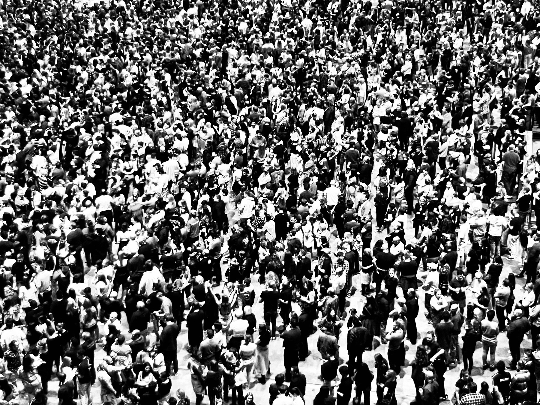 A large crowd of people with obscured faces